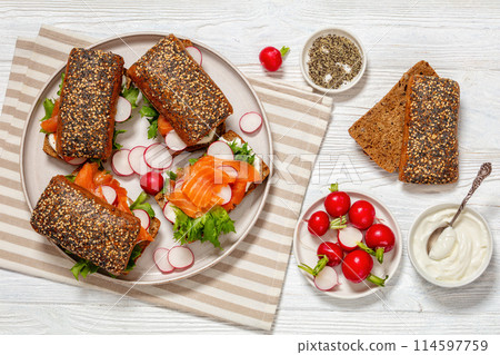 smoked salmon sandwiches on rye bread rolls smoked salmon sandwiches on rye bread rolls 114597759