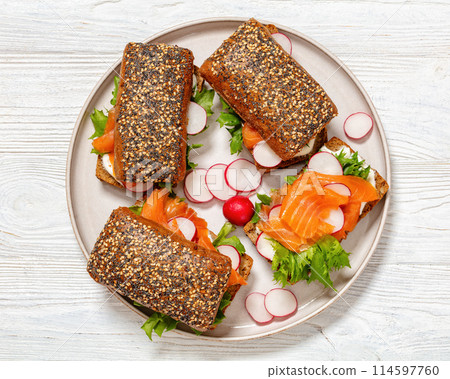 smoked salmon sandwiches on rye bread rolls 114597760