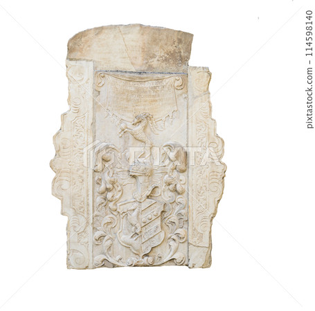 the old tombstones and reliefs on the wall 114598140