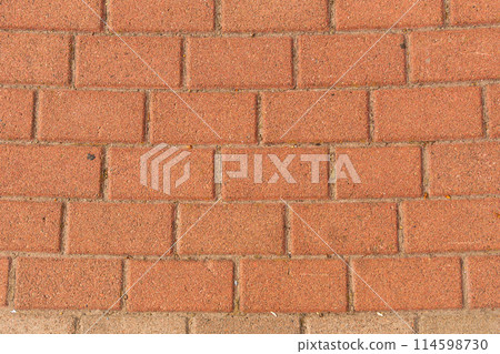 Red brick pavement texture with a regular, rectangular pattern. 114598730