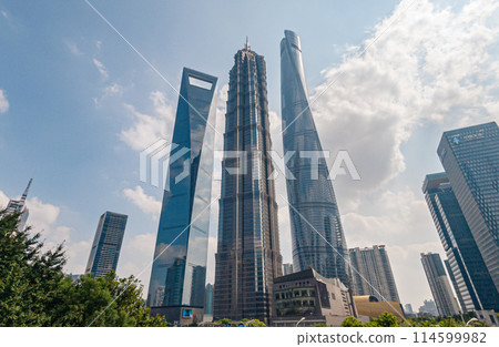 Shanghais iconic skyscrapers on a sunny day with blue skies and white clouds 114599982
