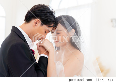 Bride and groom showcase their rings, a close-up view., symbolizing eternal love and commitment - wedding ceremony concept Bride and groom showcase their rings, a close-up view., symbolizing eternal love and commitment - wedding ceremony concept 114600344