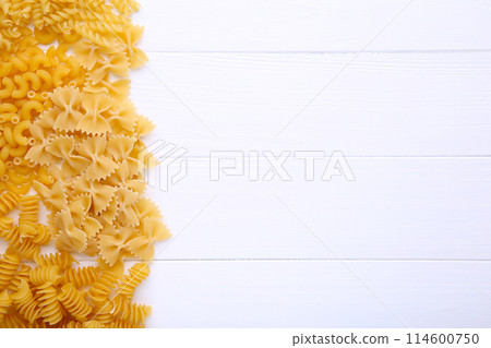 Delicious mixed pasta on a white wooden background Delicious mixed pasta on a white wooden background 114600750