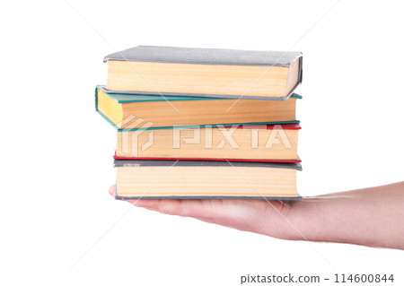 Hand holding old books on white background 114600844