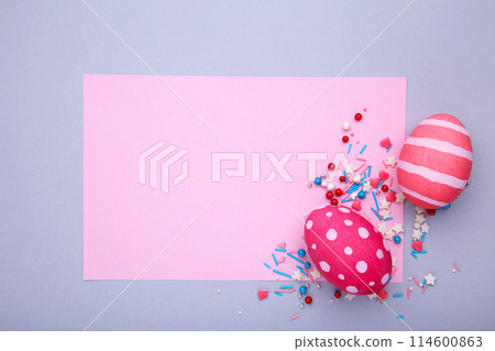 Colorful easter eggs with sprinkles on a grey background Colorful easter eggs with sprinkles on a grey background 114600863