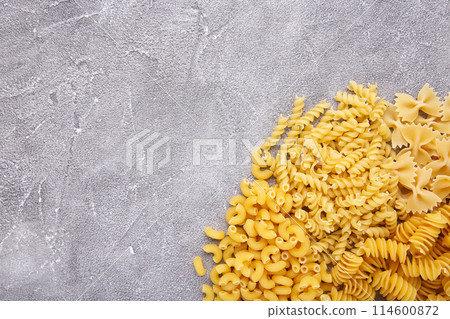 Delicious mixed pasta on a grey concrete background, frame 114600872