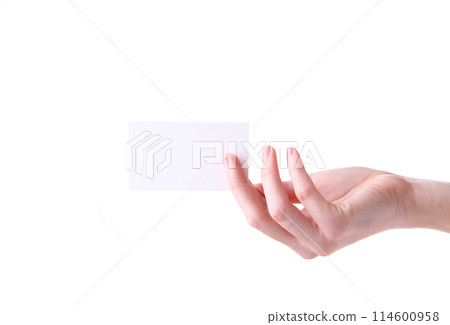 Woman holding white business card in hand isolated on a white background. Woman holding white business card in hand isolated on a white background. 114600958