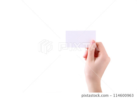 Woman holding white business card in hand isolated on a white background. Woman holding white business card in hand isolated on a white background. 114600963