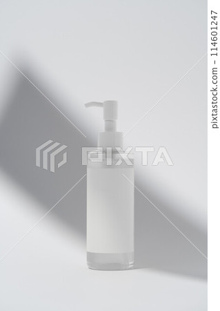 Blank label on product bottle in shadow on white background Blank label on product bottle in shadow on white background 114601247