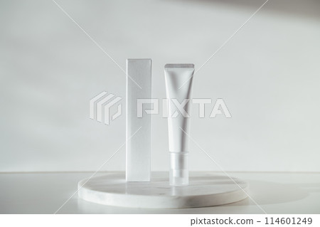 Blank cream tube and box on marble white background Blank cream tube and box on marble white background 114601249