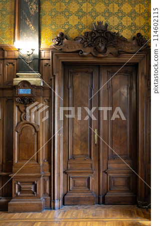 Antique old ornate wooden door with beautiful carvings Antique old ornate wooden door with beautiful carvings 114602115