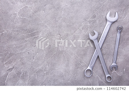 Combination wrenches for repair on grey background 114602742