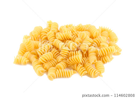 Uncooked spirelli isolated on a white background. 114602808