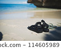 Couple's sandals on the beach 114605989