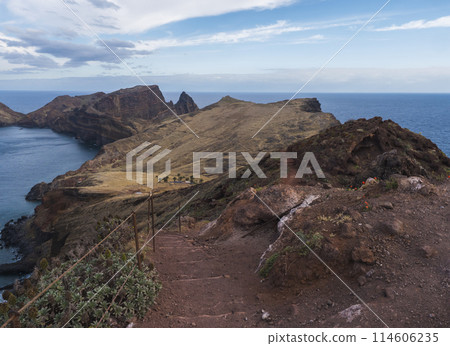 Cape Ponta de Sao Lourenco, Canical, East coast of Madeira Island, Portugal. Scenic volcanic landscape of Atlantic Ocean, rocks and cllifs and cloudy sunrise sky. Views from popular hiking trail PR8 114606235