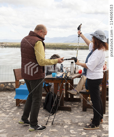 senior friends tourists outdoor adventure together on mediterranian sea landscape 114606583