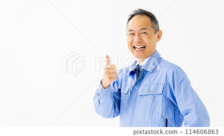 Man in work clothes thumbs up 114606863