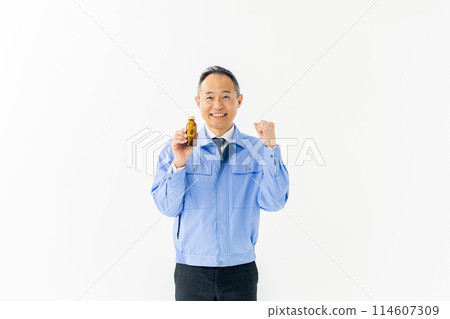 Man in work clothes Energy drink 114607309