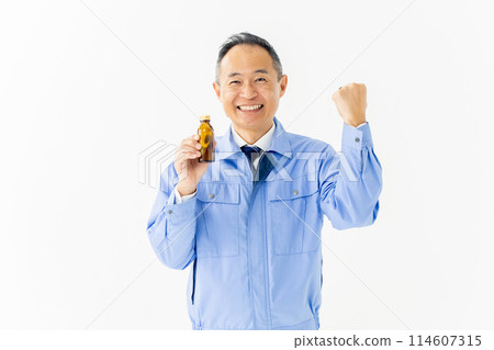 Man in work clothes Energy drink Man in work clothes Energy drink 114607315