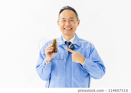 Man in work clothes Energy drink 114607318