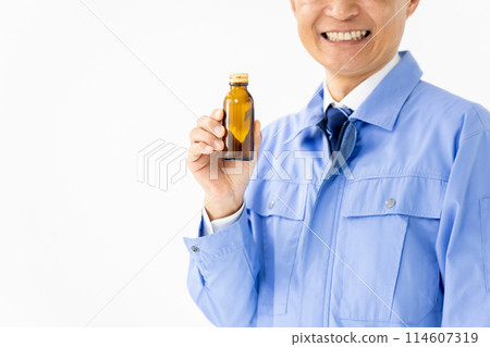 Man in work clothes Energy drink 114607319