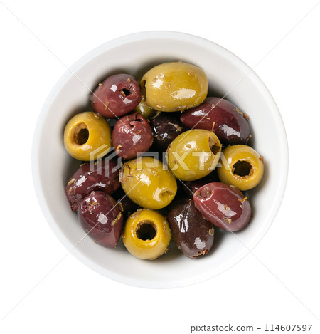 Pitted Kalamata and green olives, in a white bowl. Mix of organic green and black Greek olives with herbs, preserved in native olive oil. Popular table olives, used as snack, appetizer or as garnish. Pitted Kalamata and green olives, in a white bowl. Mix of organic green and black Greek olives with herbs, preserved in native olive oil. Popular table olives, used as snack, appetizer or as garnish. 114607597