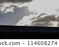 Kite flying over the roof 114608274