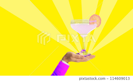 Hand holding Margarita cocktail on bright yellow background. Sweet and sour drink. Party. Contemporary art collage. 114609013