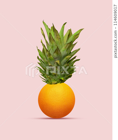 Colorful composition with pineapple on top and orange on bottom, showcasing a burst of summer flavors. Contemporary art collage. 114609017