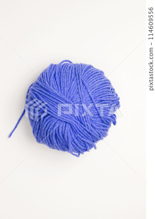 Color yarn for knitting, white background. Top view. Copy space, flat lay Color yarn for knitting, white background. Top view. Copy space, flat lay 114609556