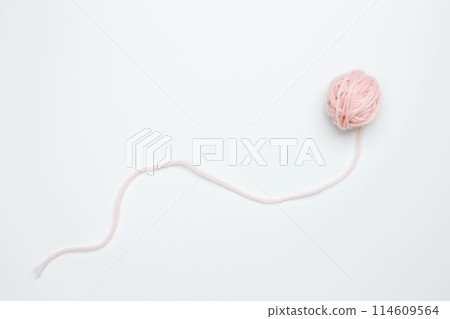 Color yarn for knitting, white background. Top view. Copy space, flat lay Color yarn for knitting, white background. Top view. Copy space, flat lay 114609564