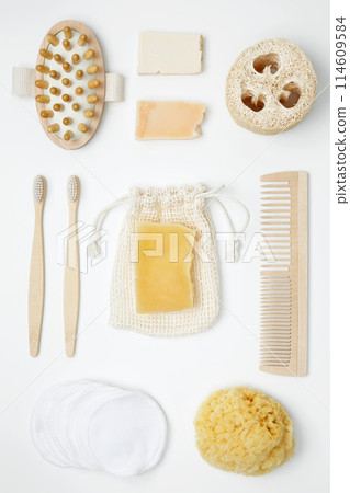 Natural organic eco cosmetics. Soap Eco, reusable cotton pads, loofah natural sponge washcloth, cotton swab, eucalyptus leaves on white background. Flat lay, top view 114609584