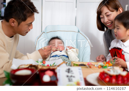 Family celebrating the beginning of a meal Family celebrating the beginning of a meal 114610287