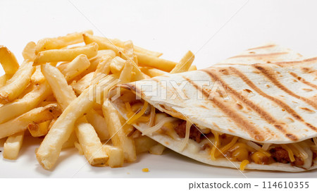 an artisan jucy quesadilla with sauce, surrounded by golden and french fries on a white background an artisan jucy quesadilla with sauce, surrounded by golden and french fries on a white background 114610355