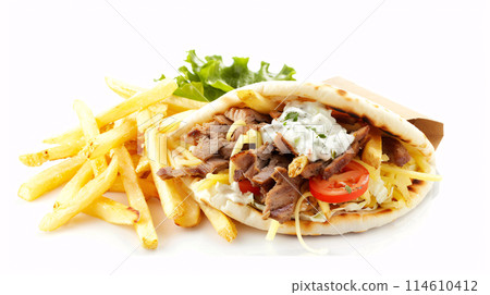an artisan juicy gyros with sauce, surrounded by golden and french fries on a white background 114610412