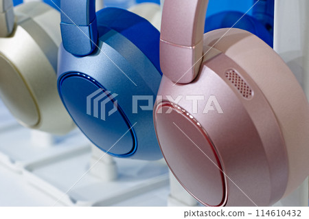 Group of modern multi-coloured wireless headphones. 114610432