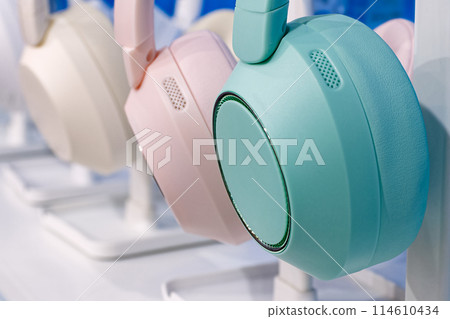 Group of modern multi-coloured wireless headphones. 114610434