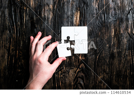 hand with missing piece of jigsaw hand with missing piece of jigsaw 114610534