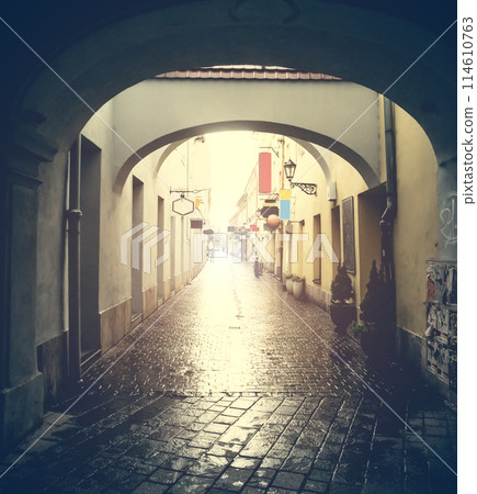 Kosice street with arches after rain 114610763