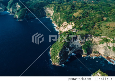 Coastline with scenic cliffs and ocean. Aerial view of Nusa Penida island 114611303