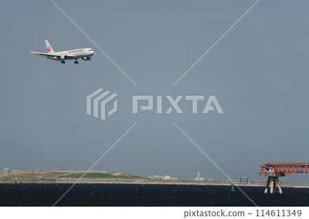 An aircraft about to land at an airport An aircraft about to land at an airport 114611349