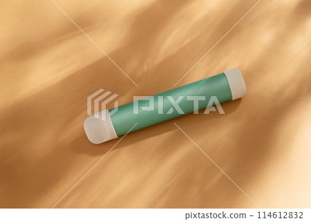 mint stick - disposable vaping device, electronic cigarette on a beige background. Flat lay, top view, minimal design with shadows of sunlight. 114612832
