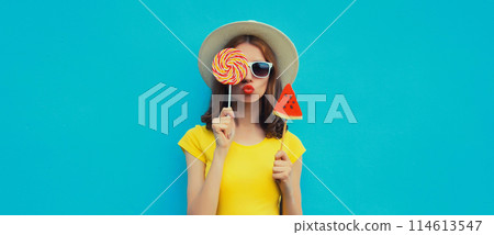 Summer portrait of stylish young woman with juicy lollipop or ice cream shaped slice of watermelon 114613547