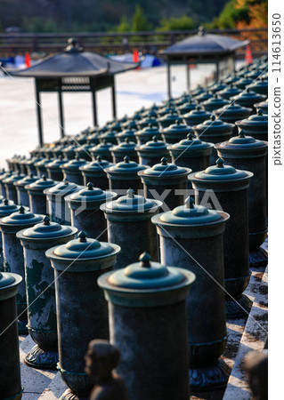 prayer cylinders or Religious prayer wheels at temple in Fukuoka Prefecture, Japan. 114613650