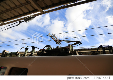 Pantograph of an electric train connecting the train to the overhead catenary wire Pantograph of an electric train connecting the train to the overhead catenary wire 114613681