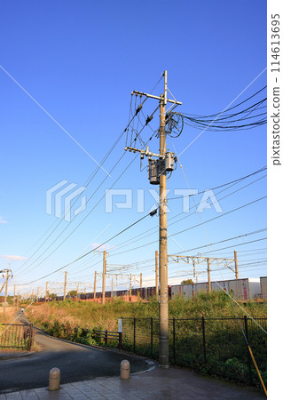 The electric pole, The electric post show with high voltage equipments and power lines, beautiful blue sky background. The electric pole, The electric post show with high voltage equipments and power lines, beautiful blue sky background. 114613695