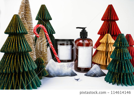 dark jar with lid and dispenser on the background of Christmas decorations, side view 114614146