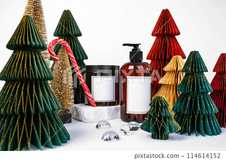 dark jar with lid and dispenser on the background of Christmas decorations, side view dark jar with lid and dispenser on the background of Christmas decorations, side view 114614152