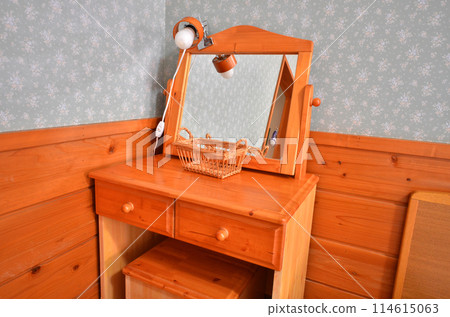 A dresser with a mirror that gives off a wooden feel 114615063