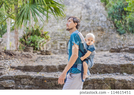 Dad and son tourists at Coba, Mexico. Ancient mayan city in Mexico. Coba is an archaeological area and a famous landmark of Yucatan Peninsula. Cloudy sky over a pyramid in Mexico Dad and son tourists at Coba, Mexico. Ancient mayan city in Mexico. Coba is an archaeological area and a famous landmark of Yucatan Peninsula. Cloudy sky over a pyramid in Mexico 114615451